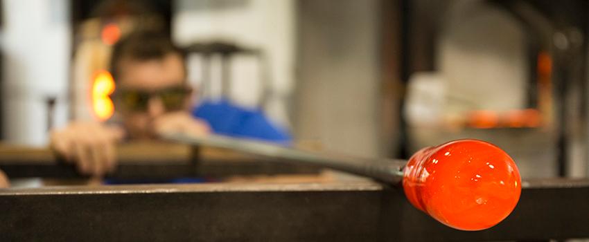 Student working in glass blowing