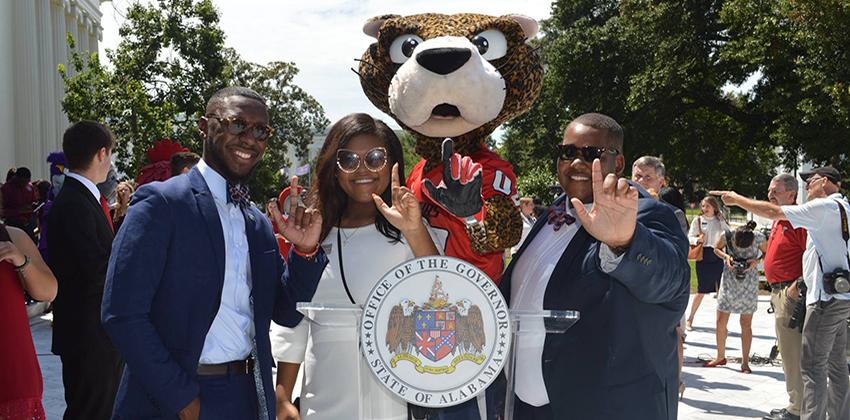 SGA members with Southpaw holding up J hand