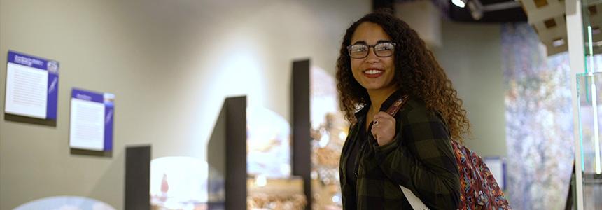 Female student smiling in art room