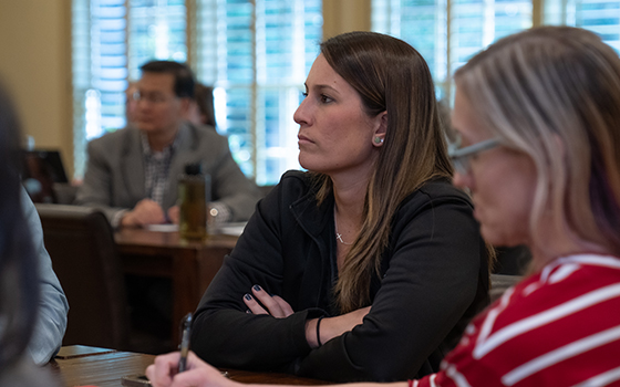 close up of faculty members listening to presentation