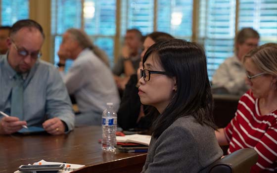 faculty members viewing presentation