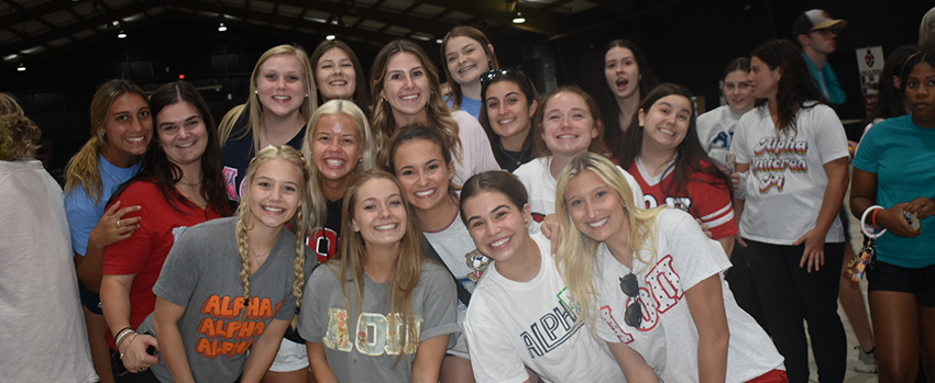 Students with sorority shirts on at Mega Musical Chairs.