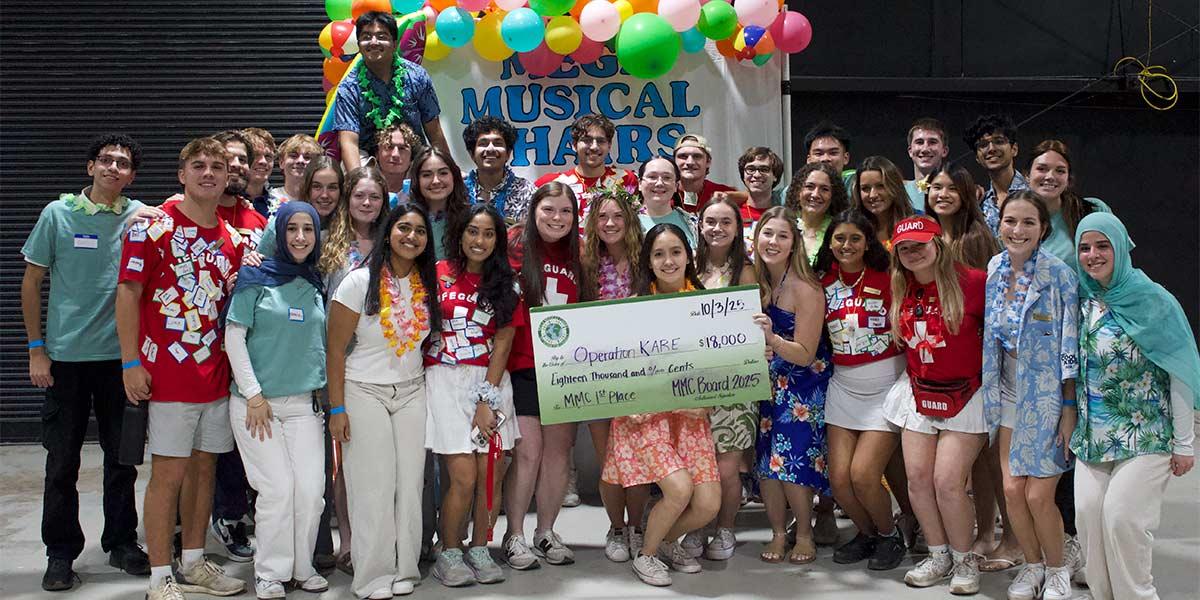 participants holding a large check