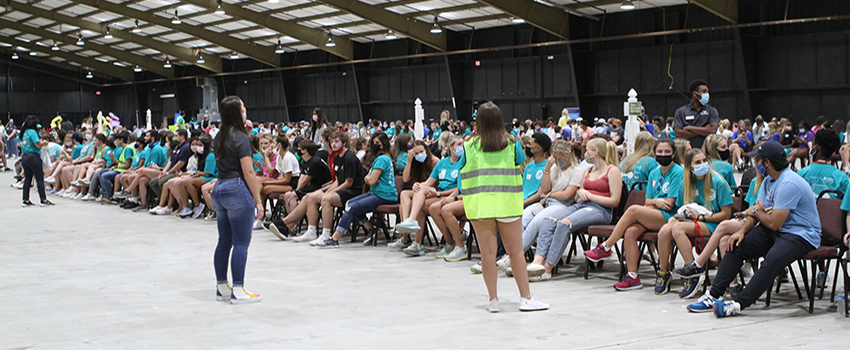 Large group in chairs starting the game.