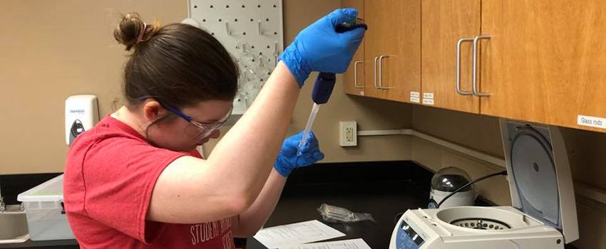 Student taking sample in the lab