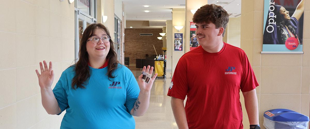 Students walking outside Jaguar Productions.