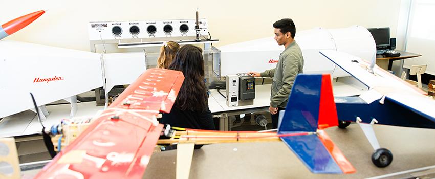 Students working in lab with plans