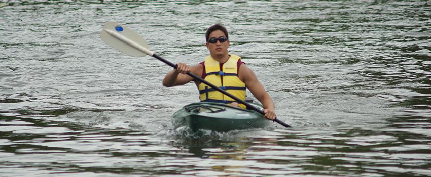 Male student kayaking