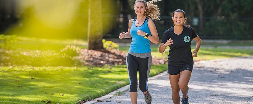 Two female students jogging