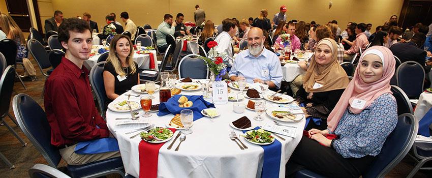 Table of students at engineering scholarship ceremony.