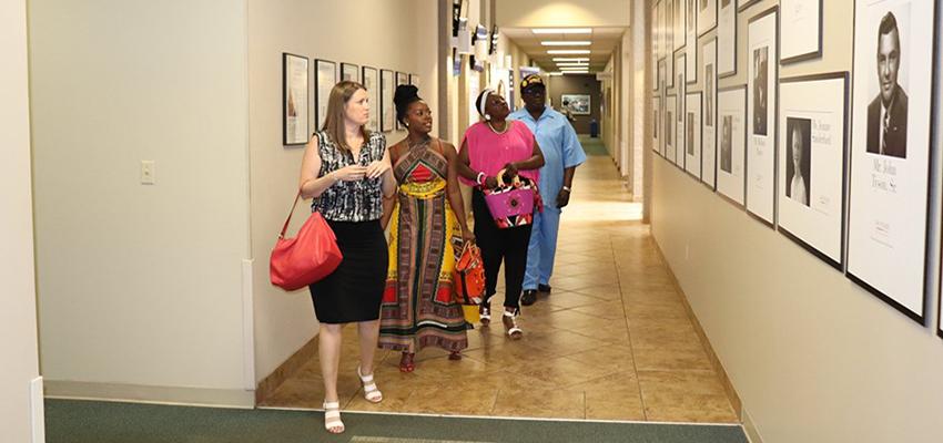 Tiffany K. Whitfield and family touring CEPS halls.