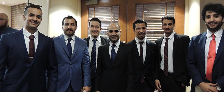 Engineering students standing in front of department.