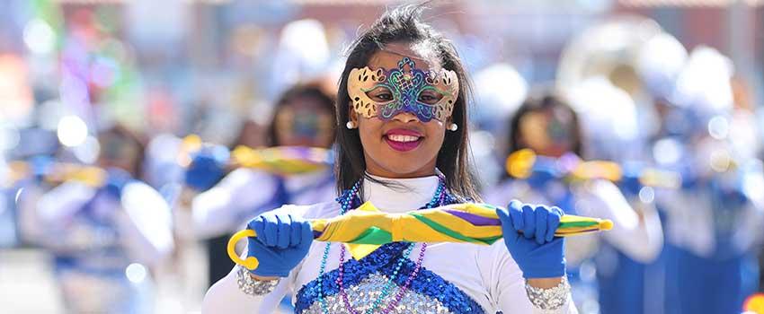 Female in Mardi Gras costume in parade