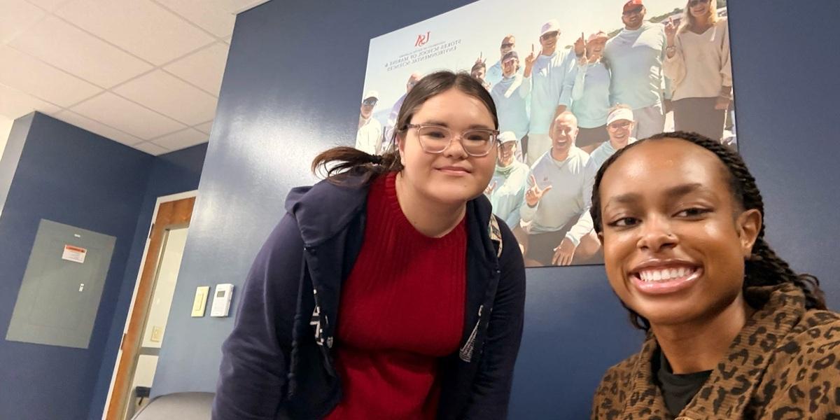 Passage USA student taking a picture with their mentor on campus