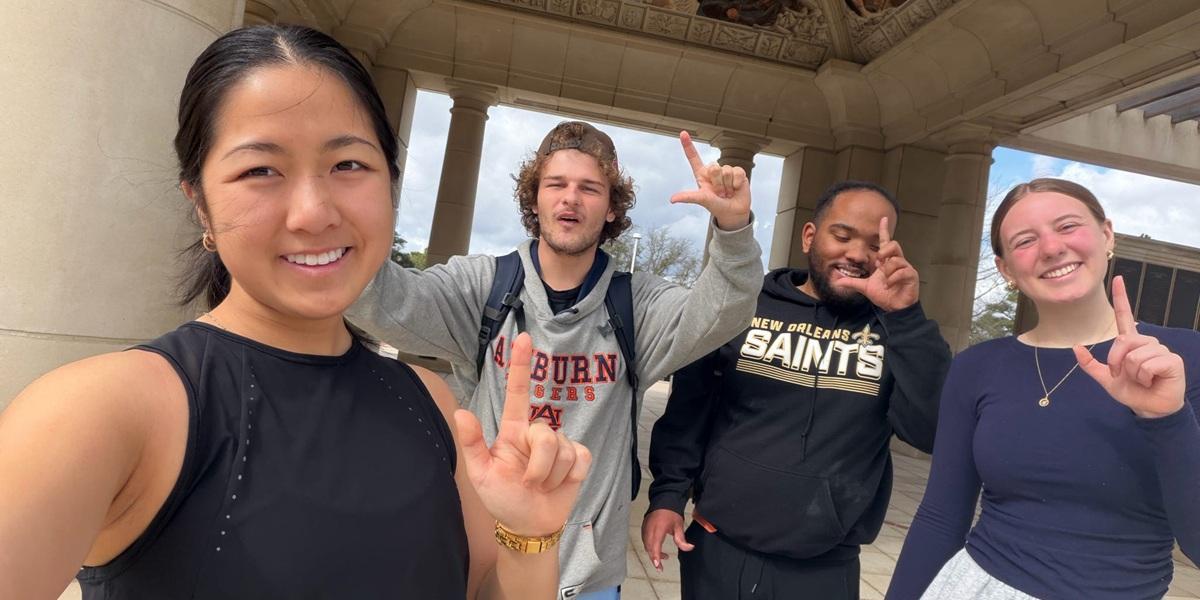 Passage USA student taking a picture with their mentor at the Moulton Tower