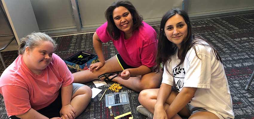 Emily, Matysan, and Aleah playing board games.Kayak
