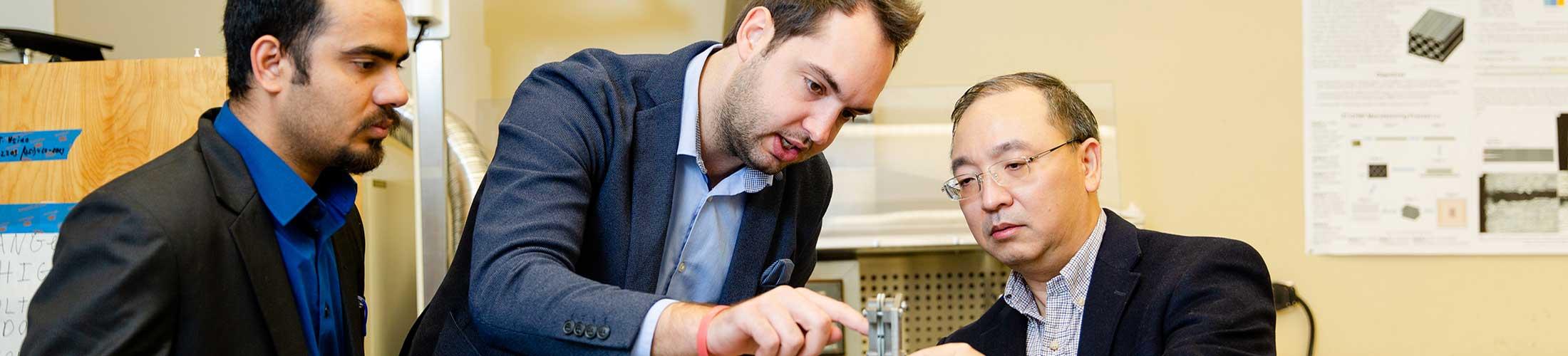 Engineering professors working in lab