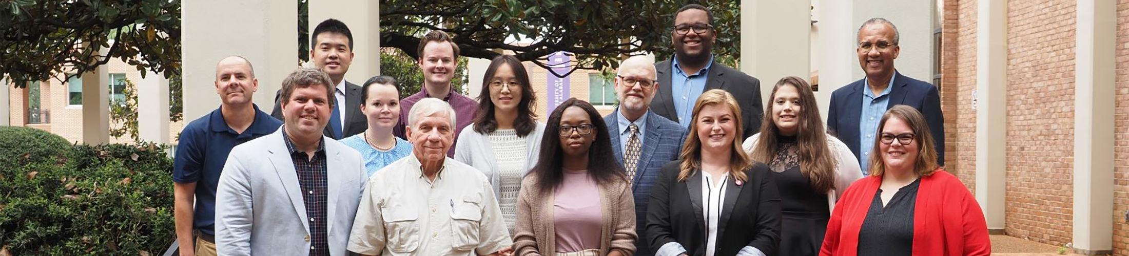 Group image of Political Science and Criminal Justice faculty standing outside.