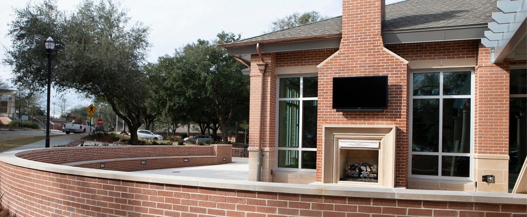 Outside patio with fireplace of MacQueen Center