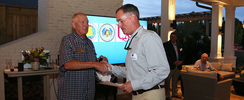 Two men shaking hands.