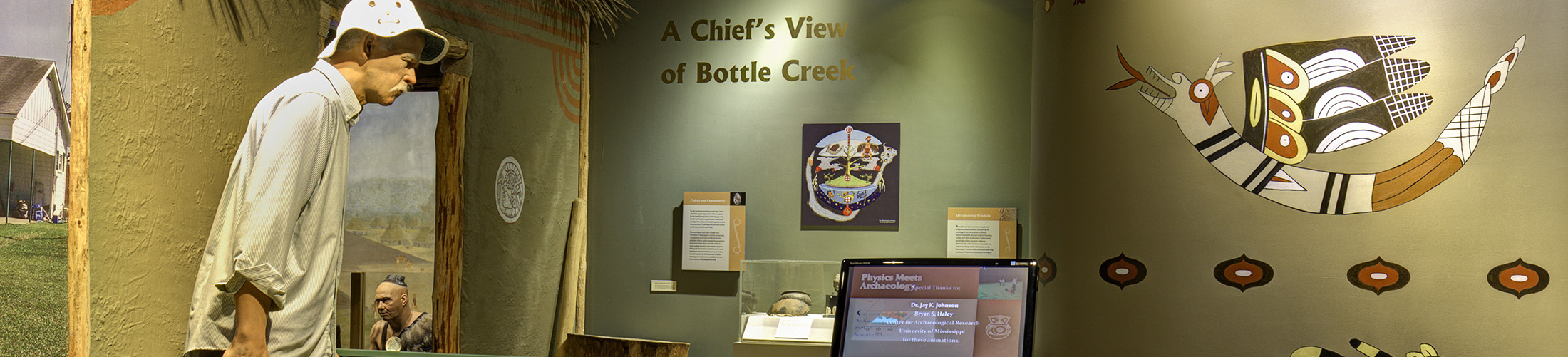 Display at museum showing mannequin. 