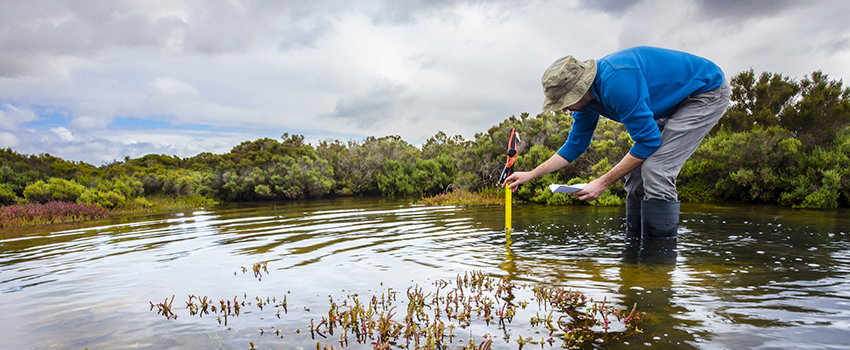 Man measuring water depth.