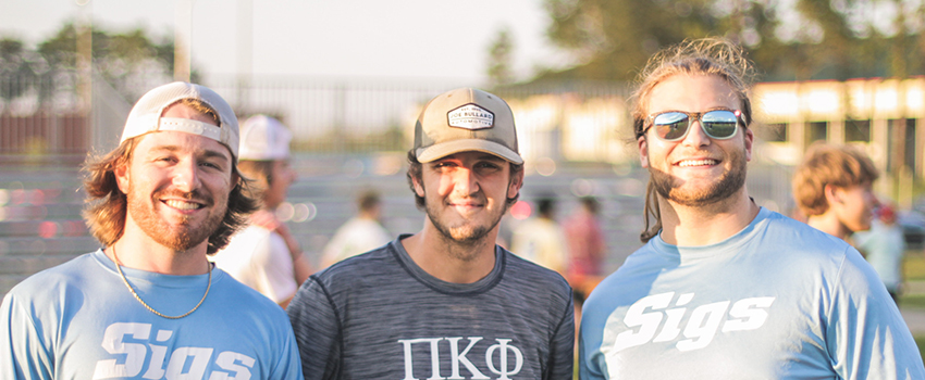 IFC members outside at an athletic event on campus.