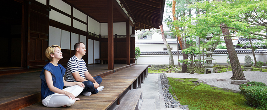 Two people meditating in Japan.