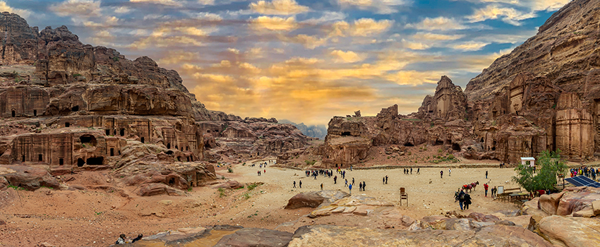 Desert scene with people viewing and hiking. 