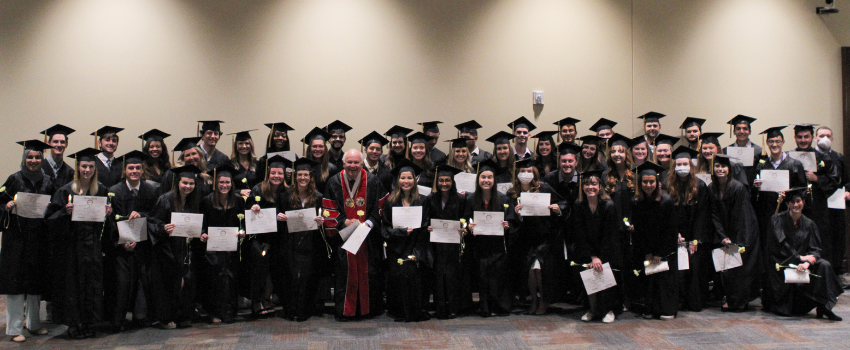 Mortar board group image in cap and gown.