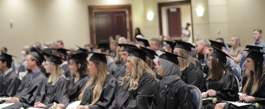 Mortar board sitting in classroom with caps on.