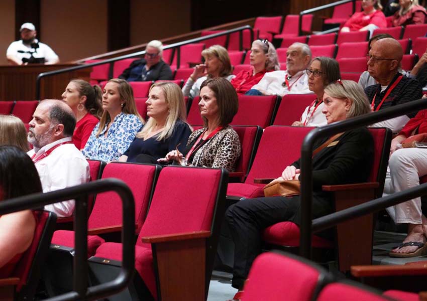 Attends listen to President Jo Bonner speak at the Meet the President Event