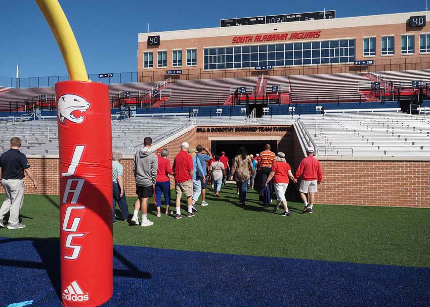 Group walking off football field.