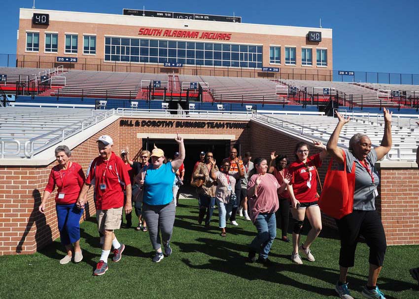 Group walking onto field.