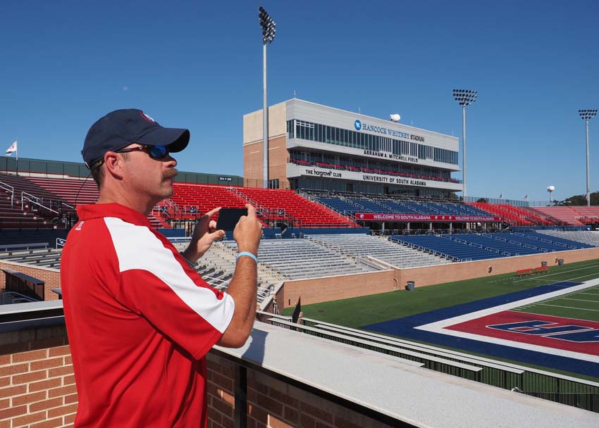 Person in stands taking a picture.