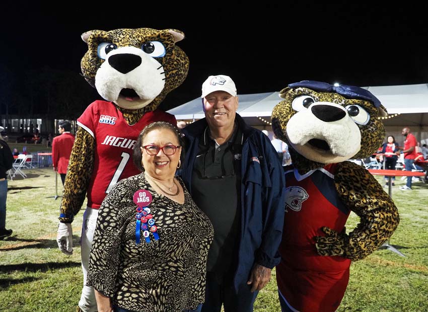 Ms. Pawla and South Paw poses for a picture with an attendee of the 2022 All Class Party