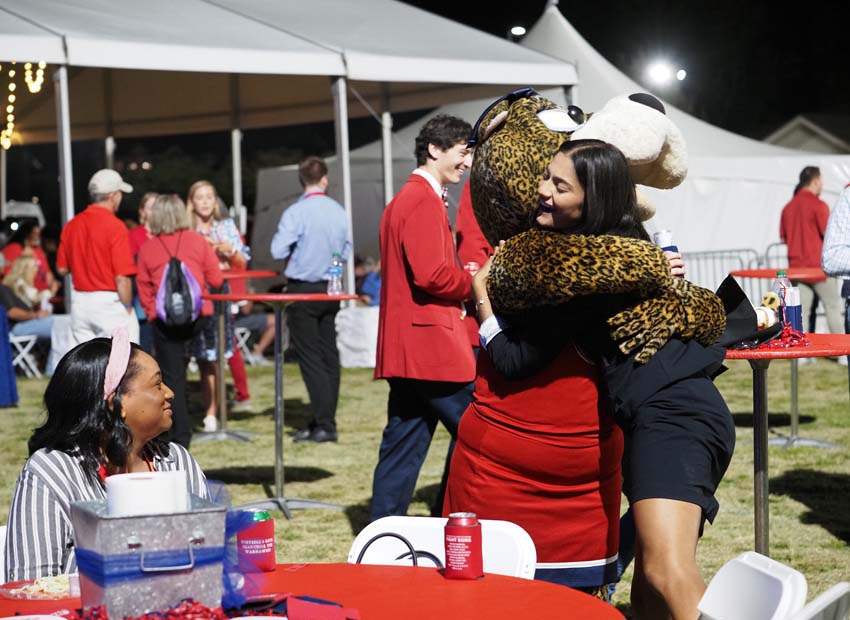 Ms. Pawla hugs an attendee of the 2022 All Class Party