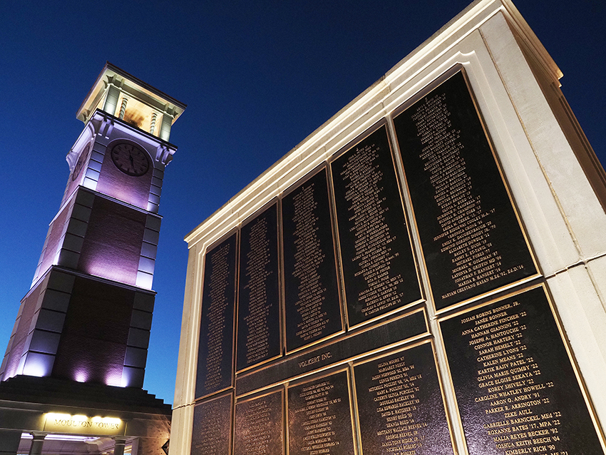 Moulton tower and wall of honor at night.
