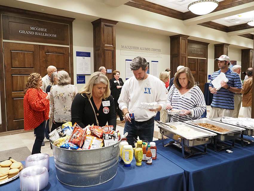 People in food line at greek reunion.