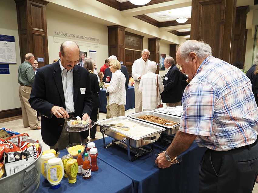 People in food line at greek reunion.