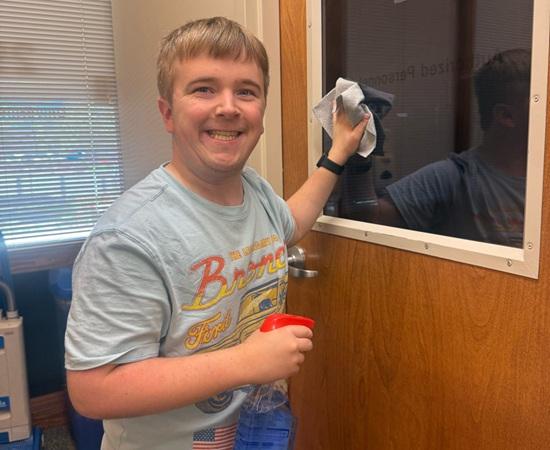 Passage USA student cleaning windows during their internship