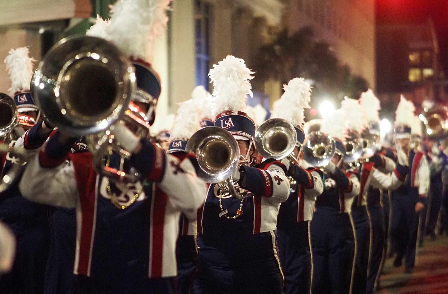 Trombone players playing in parade.