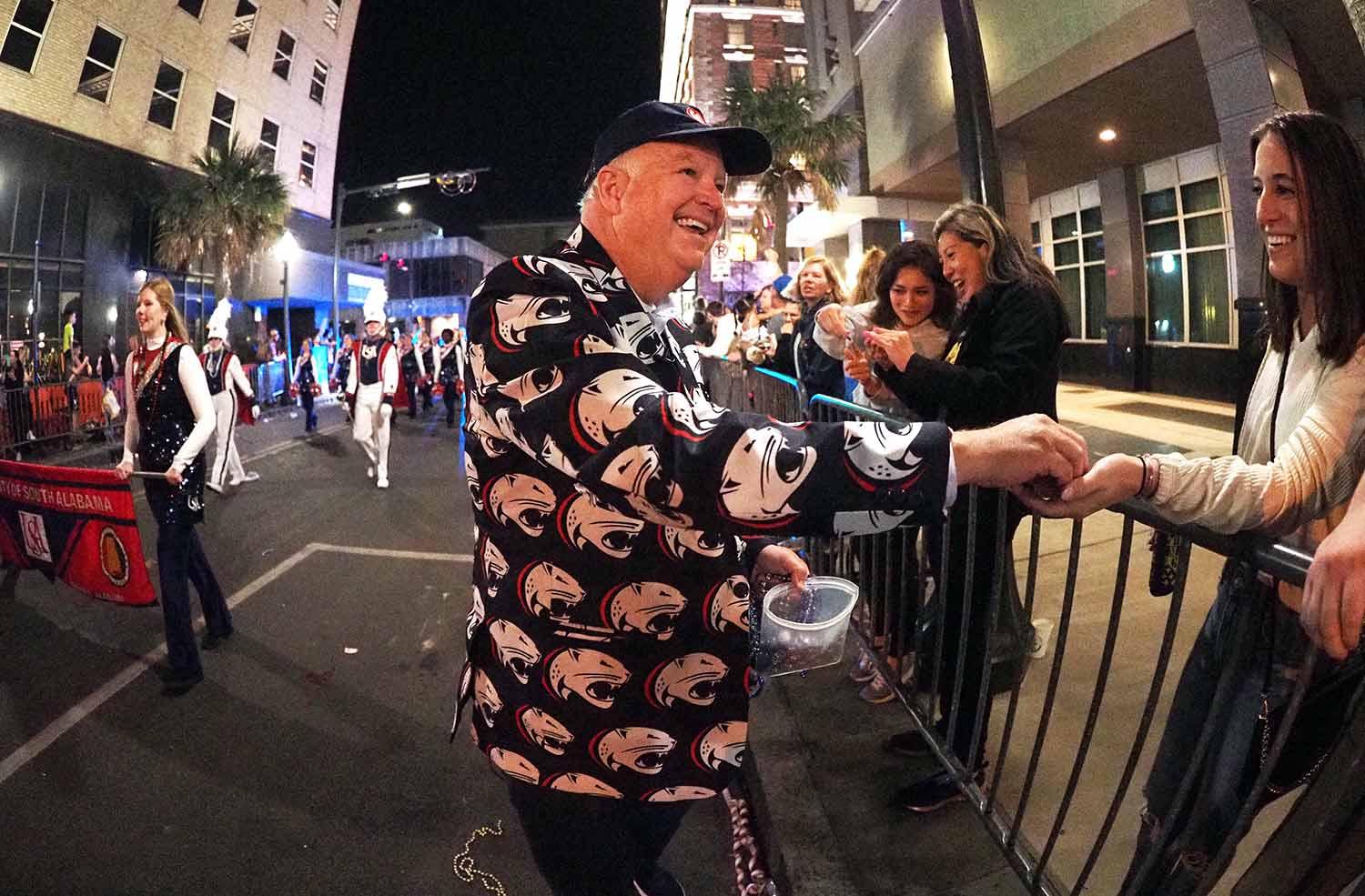 President Bonner handing out buttons in parade.