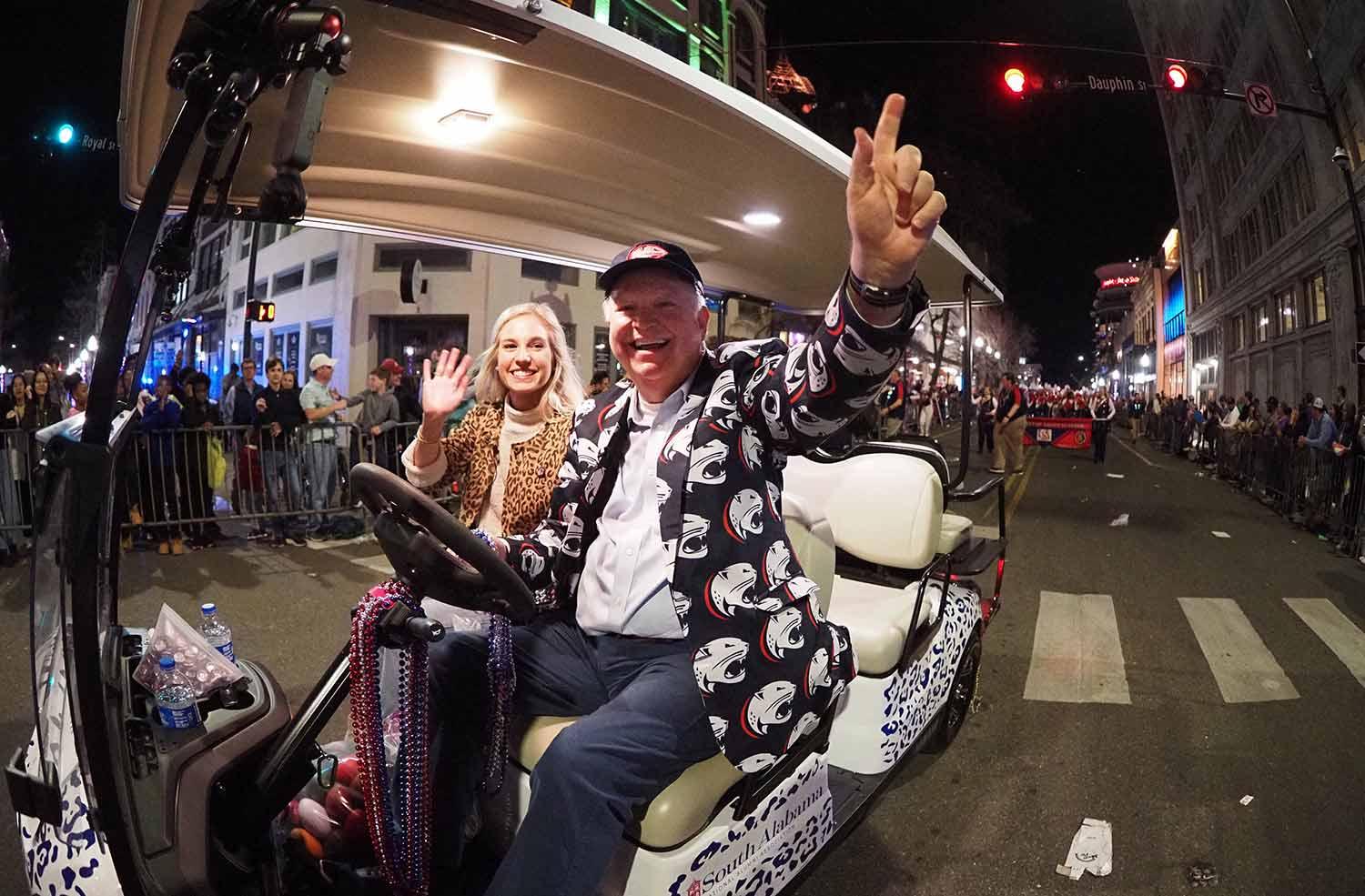 President Bonner in golf cart at parade.