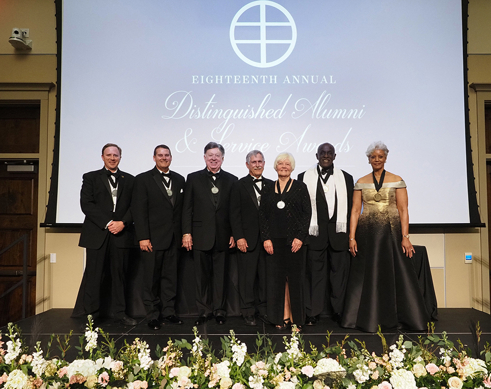 Distinguished Awards recipients on stage in group image.