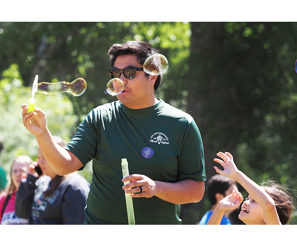 Student blowing bubbles.