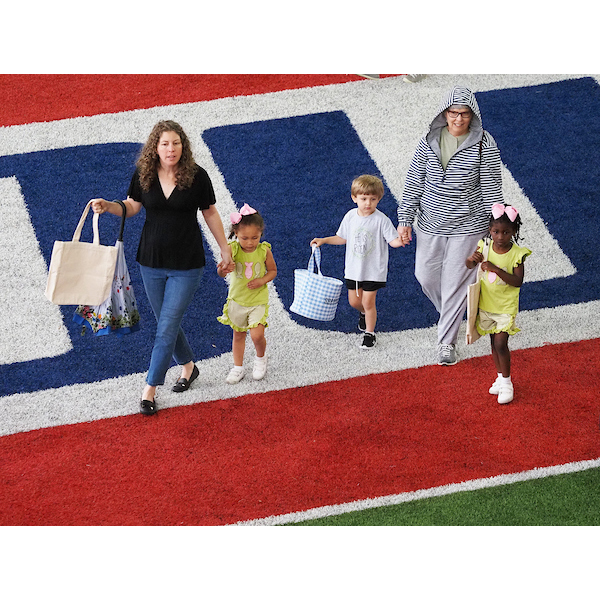 families walking down the field 