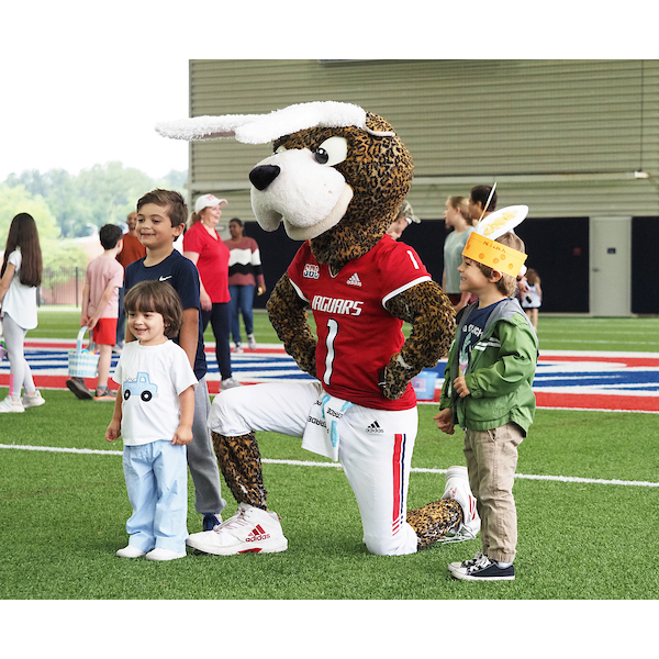 southpaw posed with several children for a photo