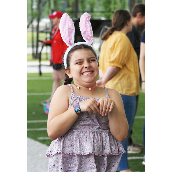 child posing with a pair of bunny ears