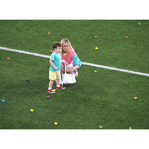 Son and mother talking on the egg field